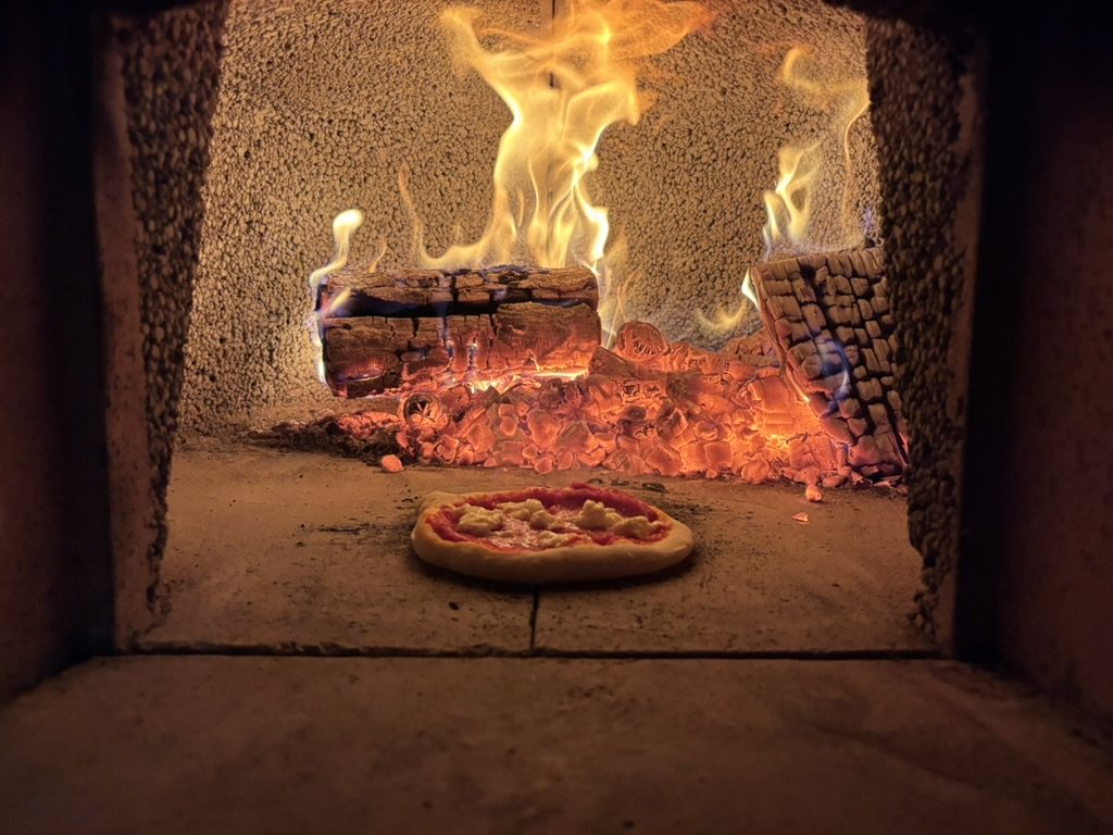 Pizza in the wood-fired oven